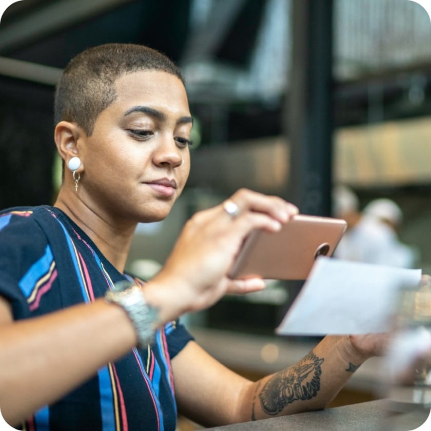 Woman taking a picture of a check