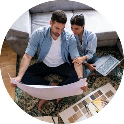 Couple reviewing blueprints